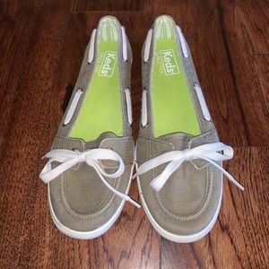 Tan Keds slip on boat shoes.